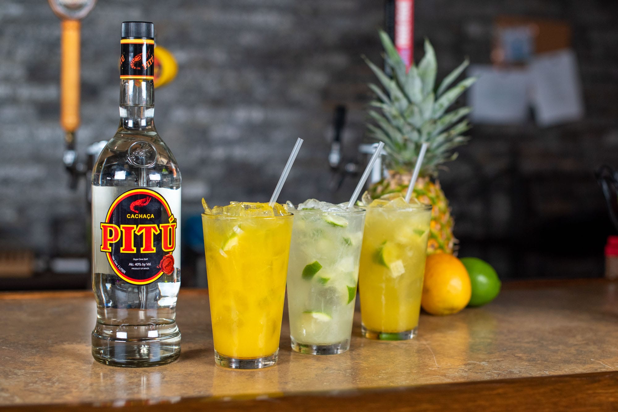 Three cocktails with cachaça and tropical fruits