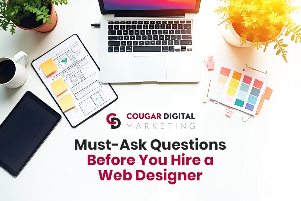 Web design hiring questions and design tools on table.