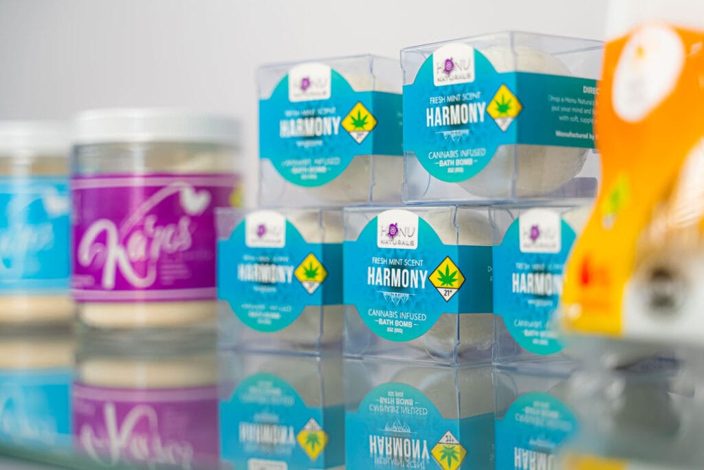 Honu Naturals cannabis bath bombs and creams display.