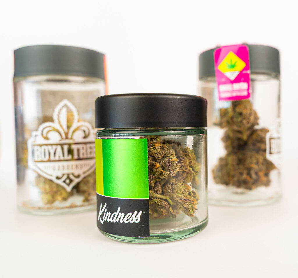 Cannabis jars with labels on white background.