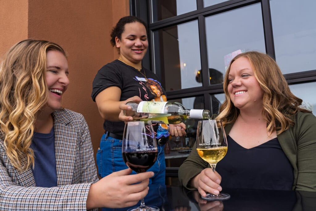 Friends enjoying wine at a winery.