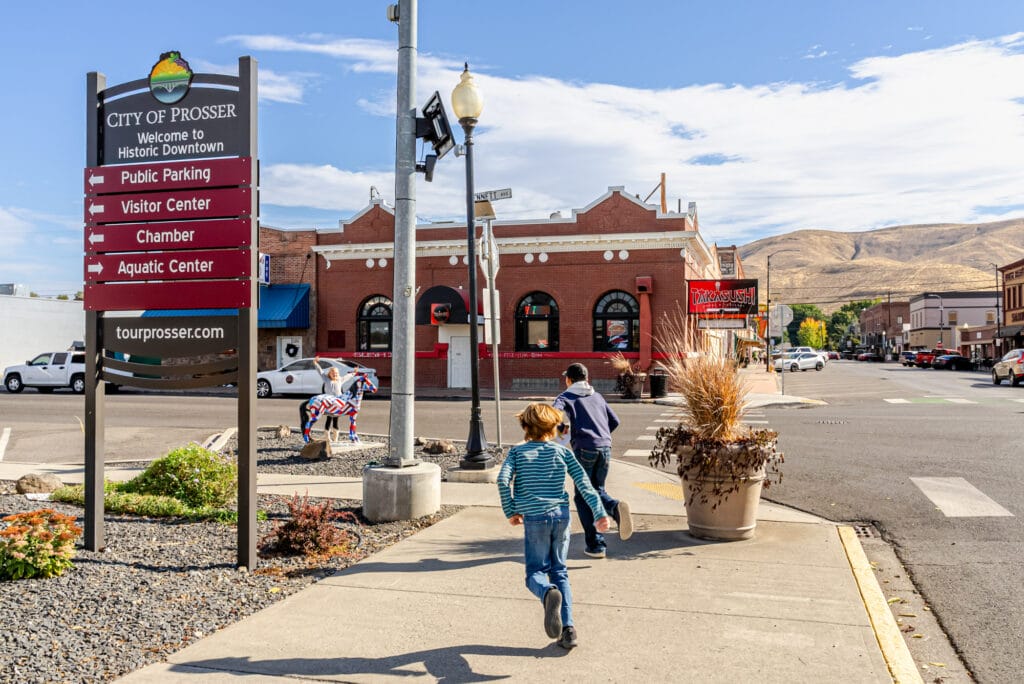 Prosser downtown street with directional signs.