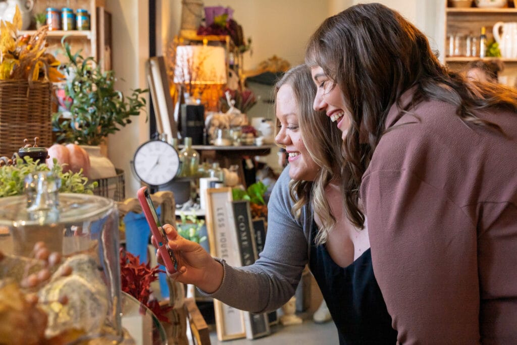 Friends enjoying a cozy shop setting.