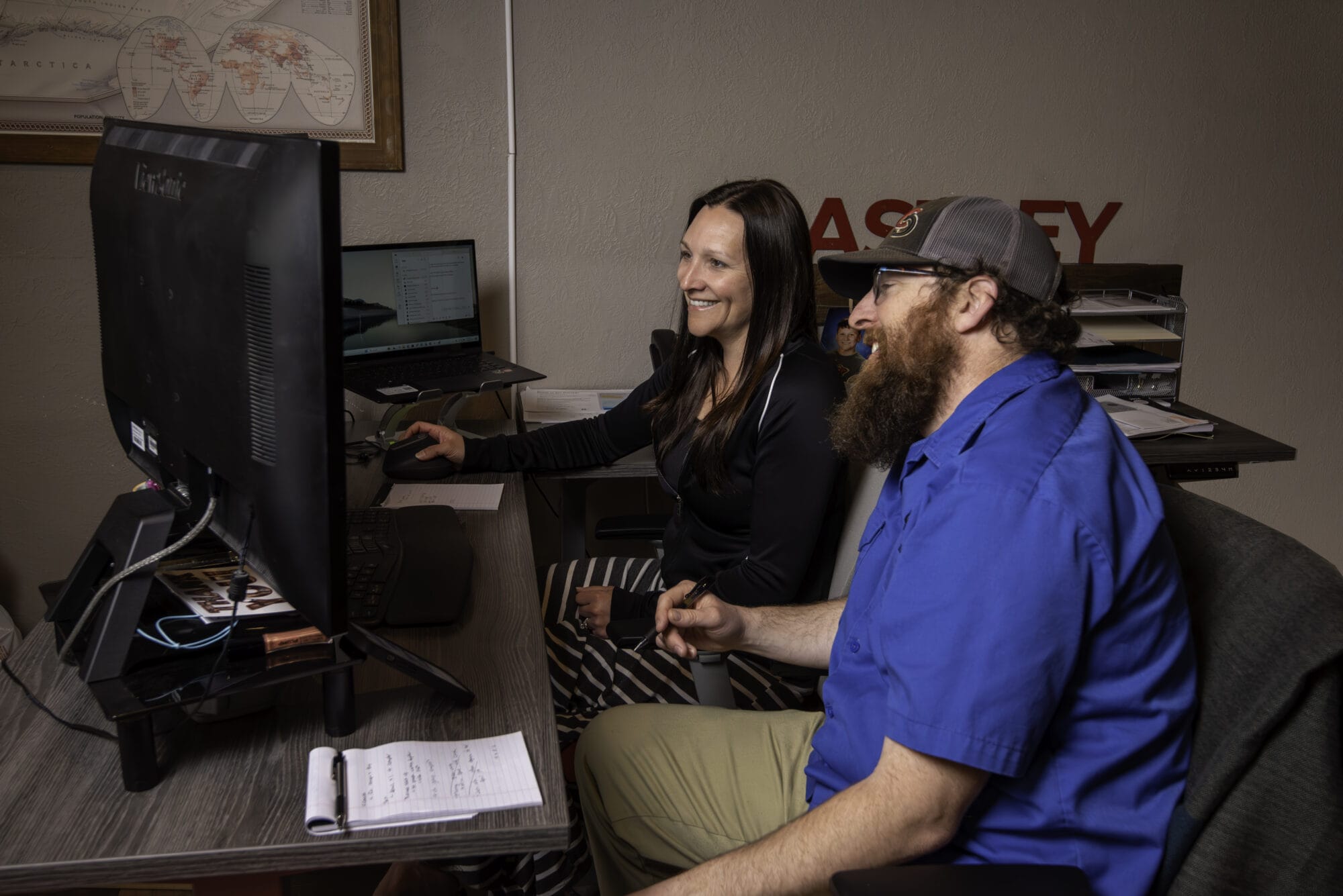 Two colleagues collaborating at a desk