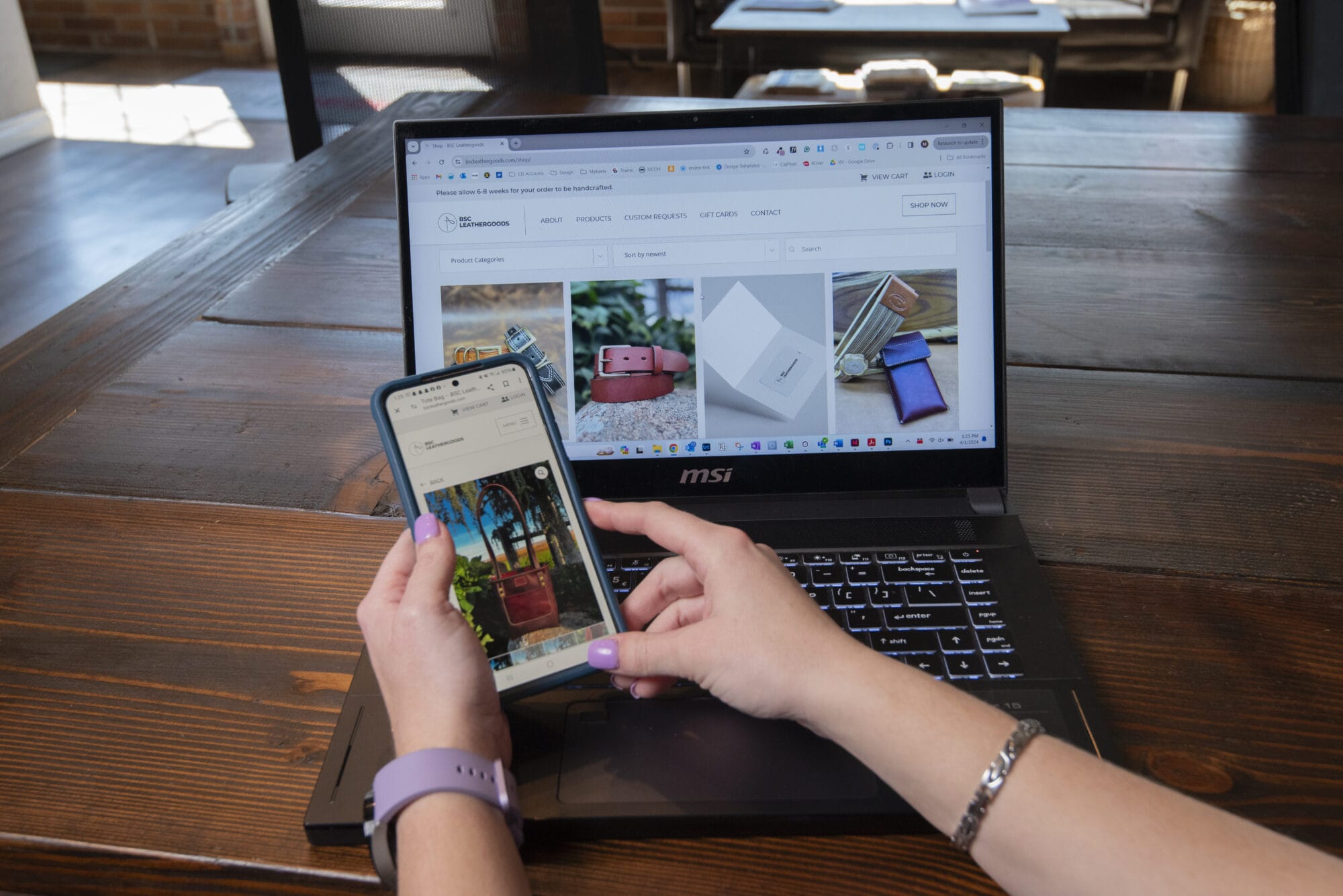 Person shopping online with laptop and phone