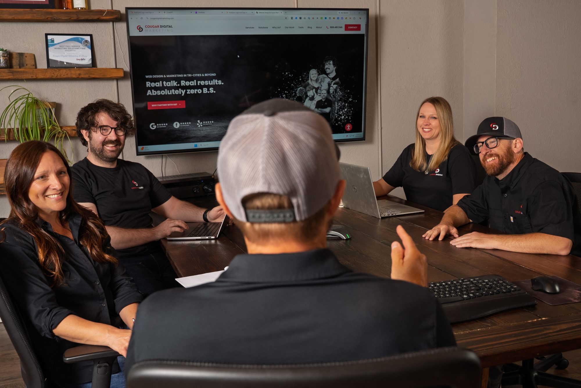 Cougar Digital marketing team meeting around conference table