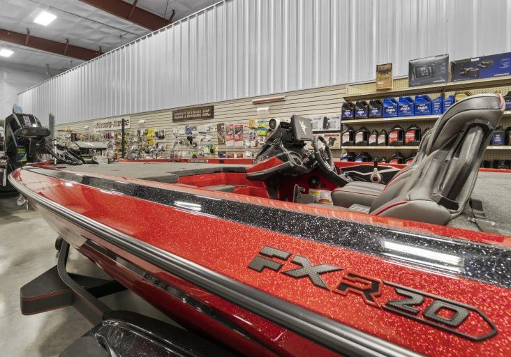 Red metallic FXR 20 bass boat in showroom