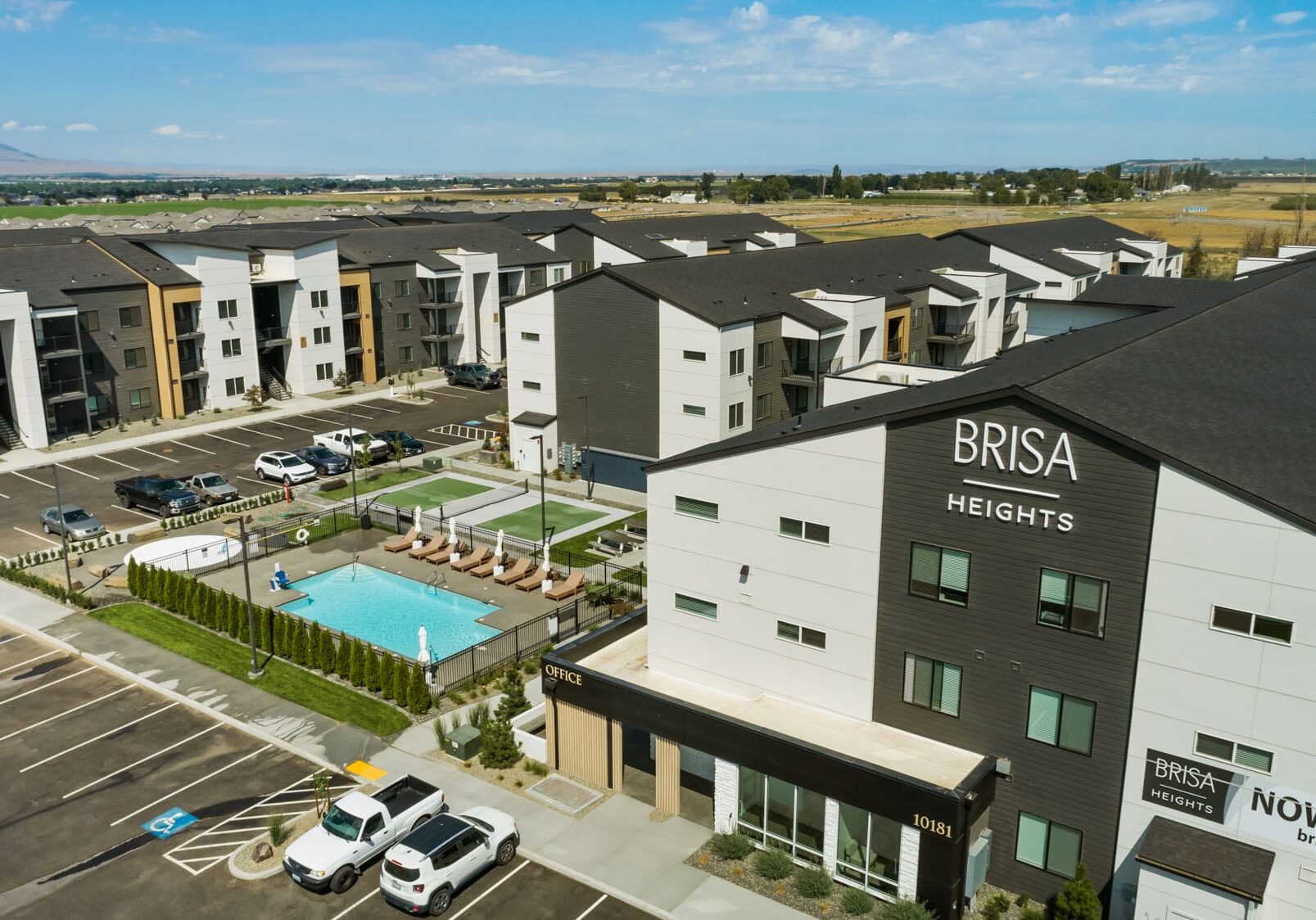 Brisa Heights apartments with pool and parking lot.